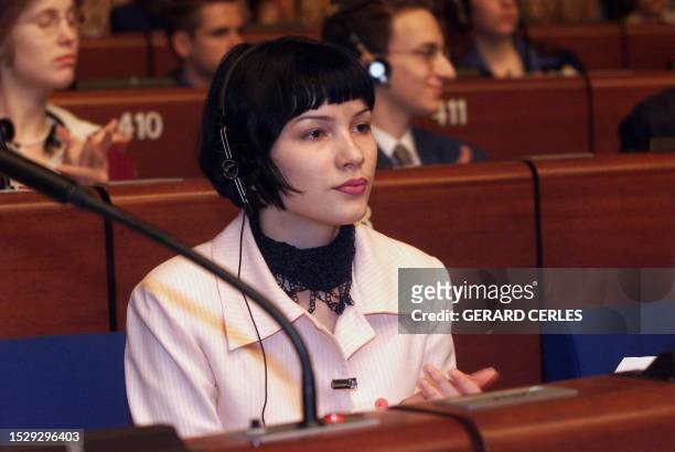 Adea Mejdani, the daughter of the president of Albania, representing youths from her country, listens 30 April 1999 to a conference on Kosovo at the...
