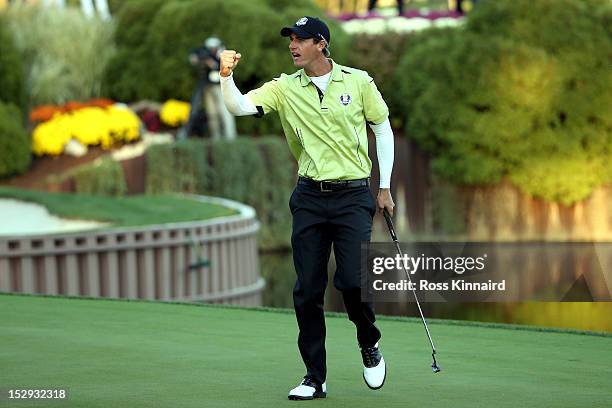 Nicolas Colsaerts of Europe celebrates a birdie putt on the 17th green during the Afternoon Four-Ball Matches for The 39th Ryder Cup at Medinah...