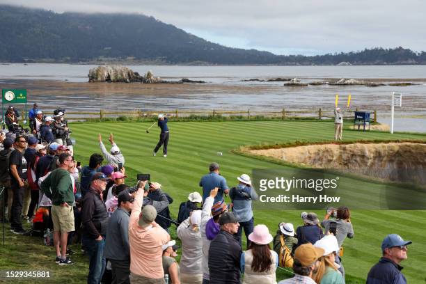Allisen Corpuz of the United States plays her shot from the 18th tee as a gallery of fans look on during the final round of the 78th U.S. Women's...