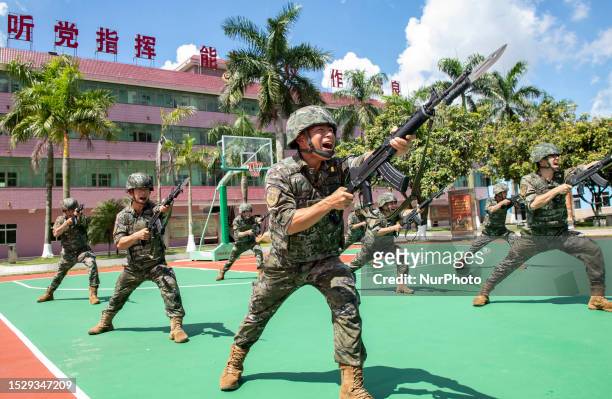 Armed police officers and soldiers conduct intensive training in high temperatures in Beihai city, Guangxi province, China, July 13, 2023.