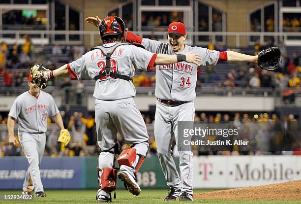 Homer Bailey of the Cincinnati Reds celebrates his no-hitter with Ryan Hanigan against the Pittsburgh Pirates during the game on September 28, 2012...
