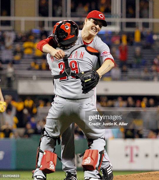 Homer Bailey of the Cincinnati Reds celebrates his no-hitter with Ryan Hanigan against the Pittsburgh Pirates during the game on September 28, 2012...
