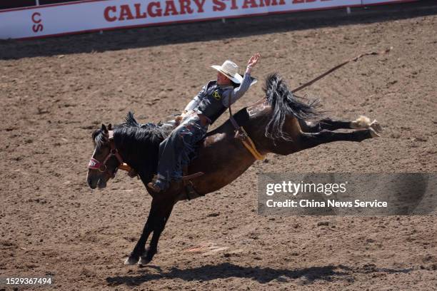 Horse rider shows his equestrian skills during the Cowboys Rangeland Derby at the Calgary Stampede on July 8, 2023 in Calgary, Canada.