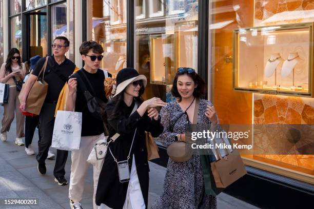 Street scene as shoppers and visitors pass by on Bond Street in the exclusive area of Mayfair on 7th July 2023 in London, United Kingdom. Bond Street...