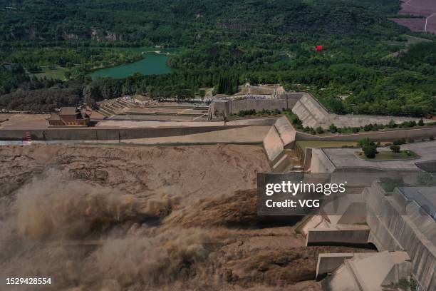 Water is released from the Xiaolangdi Dam on the Yellow River during a sand-discharging operation on July 9, 2023 in Luoyang, Henan Province of China.