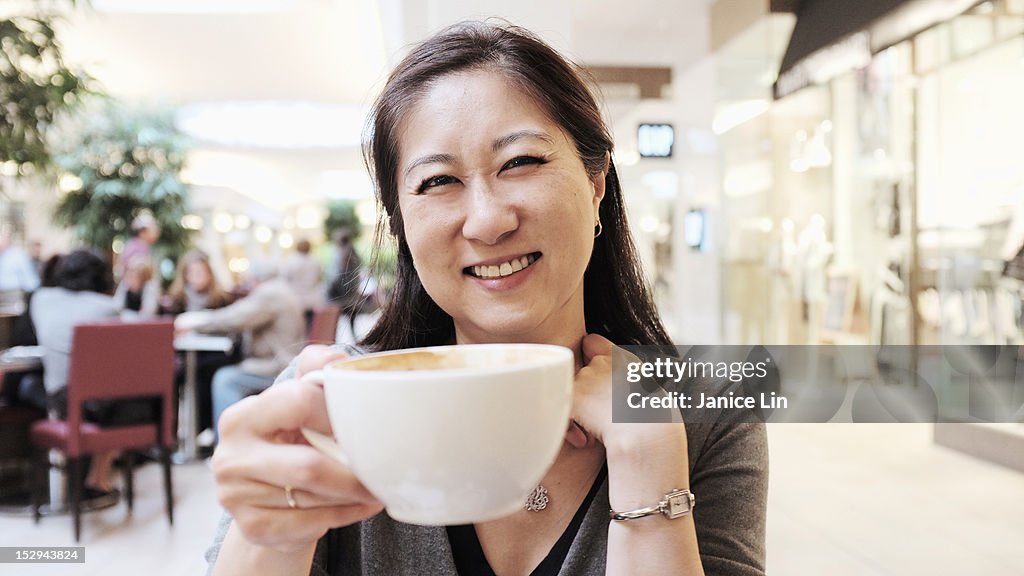 Woman happy to drink her coffee
