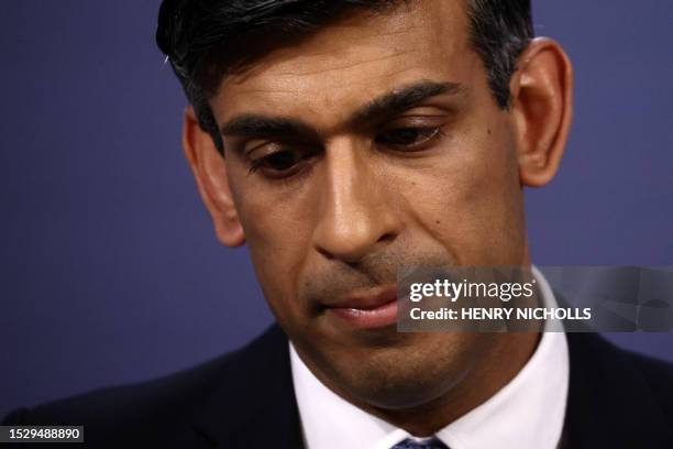 Britain's Prime Minister Rishi Sunak gestures as he speaks at a press conference at Number 9 Downing Street on public sector pay in London on July...