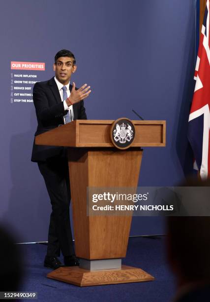 Britain's Prime Minister Rishi Sunak gestures as he speaks at a press conference at Number 9 Downing Street on public sector pay in London on July...