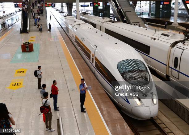 The first high-speed train between Zhengzhou and Wuhan runs into the Wuhan Railday Station on September 28, 2012 in Wuhan, Hubei Province of China....