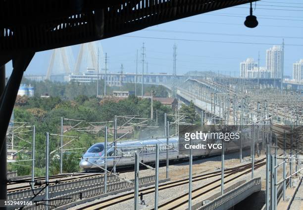 The first high-speed train between Zhengzhou and Wuhan runs into the Wuhan Railday Station on September 28, 2012 in Wuhan, Hubei Province of China....