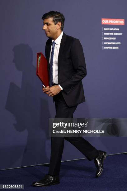 Britain's Prime Minister Rishi Sunak leaves after holding at a press conference at Number 9 Downing Street on public sector pay in London on July 13,...