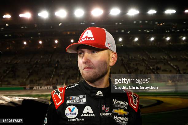 William Byron, driver of the Axalta Chevrolet, waits on the grid during a weather delay of the NASCAR Cup Series Quaker State 400 Available at...