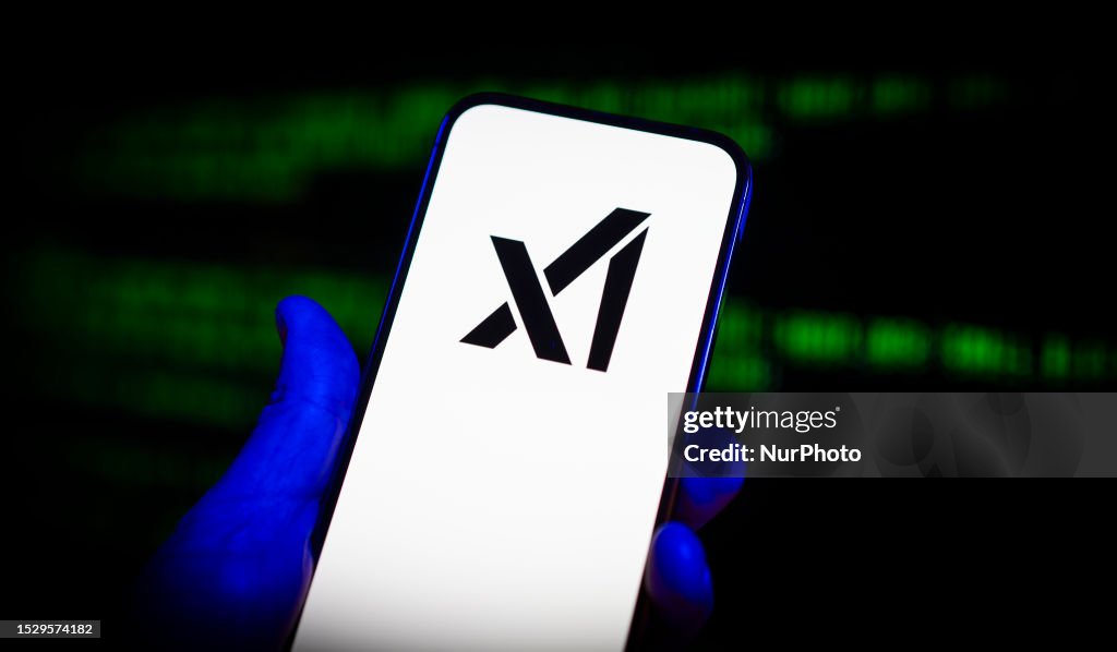 The xAI logo is seen on a mobile device in this photo illustration on