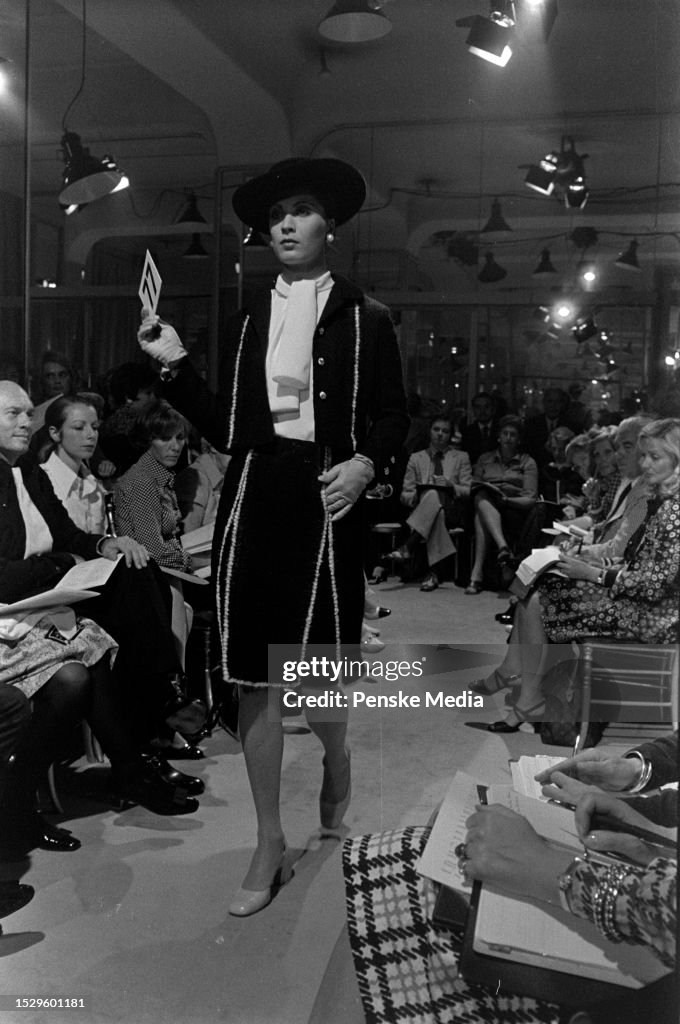 A model presents a look in the Chanel Fall 1973 Couture fashion show ...