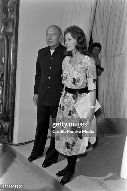 Actor Yul Brynner and Jacqueline de Croisset attend the Chanel Fall 1973 Couture fashion show, designed by Ramon Esparza, on July 15 in Paris, France.