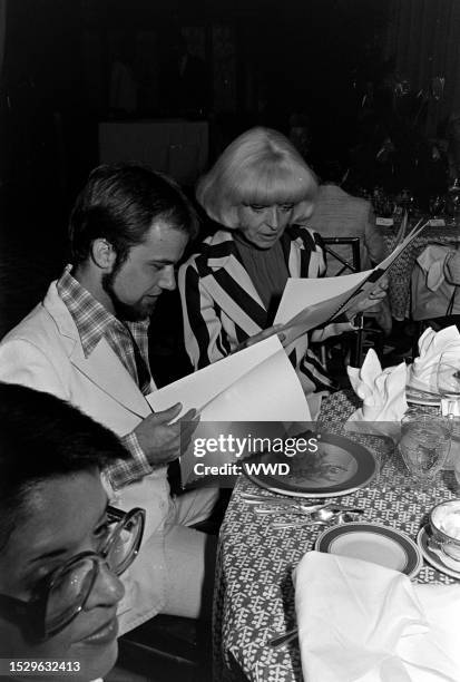 Bob Mackie, Carol Channing, and guests attend the Cole of California Beach and Beyond by Bob Mackie 1977 Swimwear Collection Hollywood gala-themed...