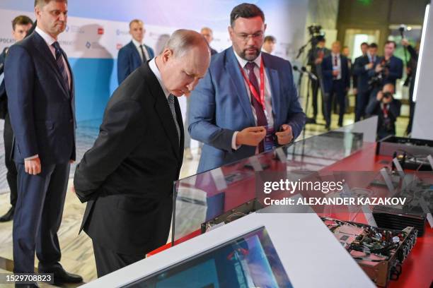 Russia's President Vladimir Putin visits an exhibition of advanced developments in the field of quantum technologies of the state corporation Rosatom...