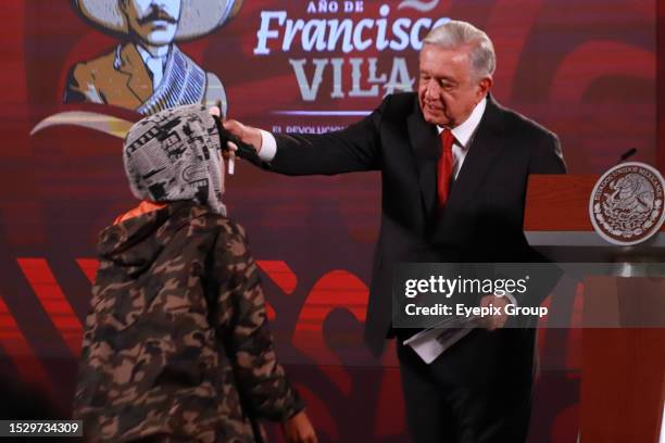 July 12, 2023 in Mexico City, Mexico: The journalist from San Luis Potosí, Ana Dora Cabrera Vázquez, approaches the President of Mexico, Andres...