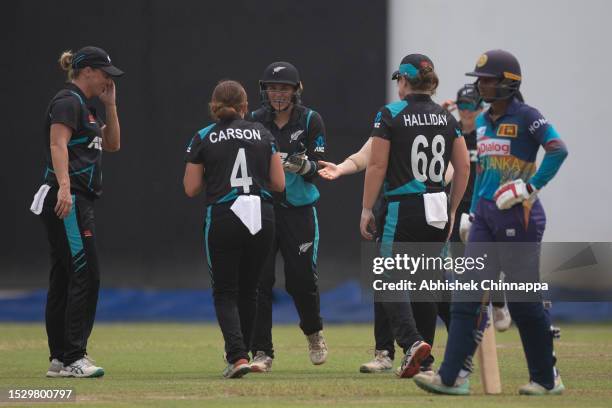 New Zealand players celebrate the dismissal of Chamari Athapaththu of Sri Lanka during game two of the T20 international series between Sri Lanka and...