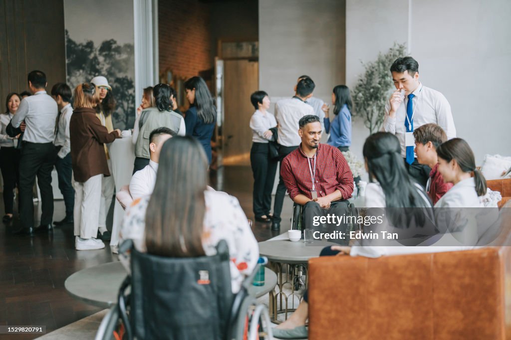 Asian Multi Ethnic business people talk during a coffee break in Seminar Business conference