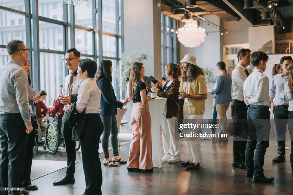 Asian Multiethnic business people talk during a coffee break in Seminar Business conference
