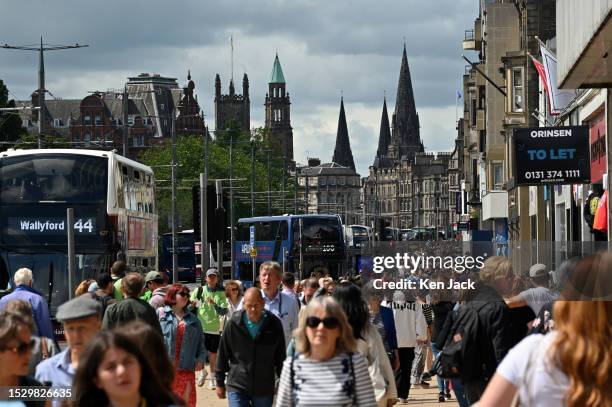 Crowds of tourists and shoppers throng Edinburgh's main thoroughfare, Princes Street, on July 13, 2023 in Edinburgh, Scotland.