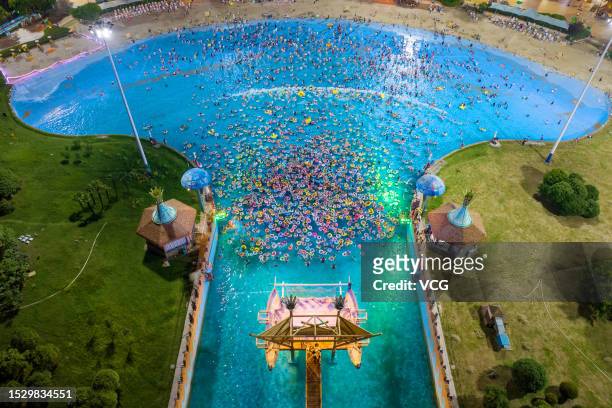 Aerial view of people cooling off at a water park during a hot summer day on July 8, 2023 in Nanjing, Jiangsu Province of China.
