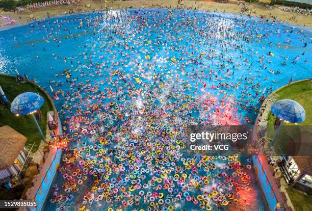 Aerial view of people cooling off at a water park during a hot summer day on July 8, 2023 in Nanjing, Jiangsu Province of China.