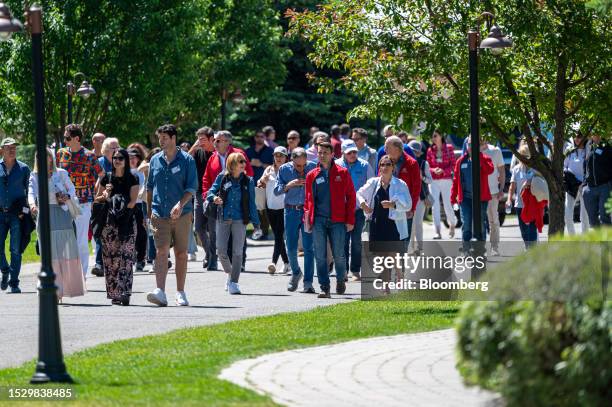 Attendees walk to lunch during the Allen & Co. Media and Technology Conference in Sun Valley, Idaho, US, on Wednesday, July 12, 2023. The summit is...