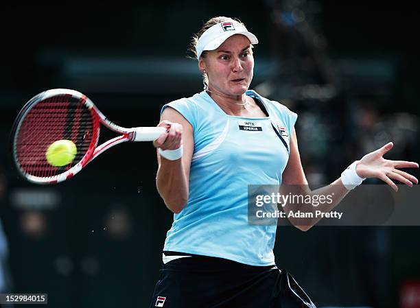 Nadia Petrova of Russia hits a forehand on her way to victory over Agnieszka Radwanska of Poland in the womens final during day seven of the Toray...