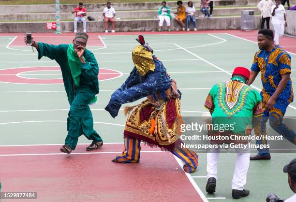 Performance featuring the masquerade Ogbam Gbada of the Igbo tribe during the second annual Nigeria Cultural Day Parade and festival on Saturday,...