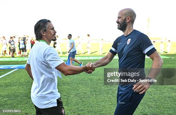 Portugal head coach Joaquim Milheiro, left, and Norway head coach Luís Pimenta shake hands before the UEFA European Under-19 Championship 2022/23...