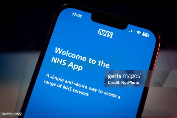 The National Health Service application is seen on a mobile device in this photo illustration on 13 July, 2023 in Warsaw, Poland.