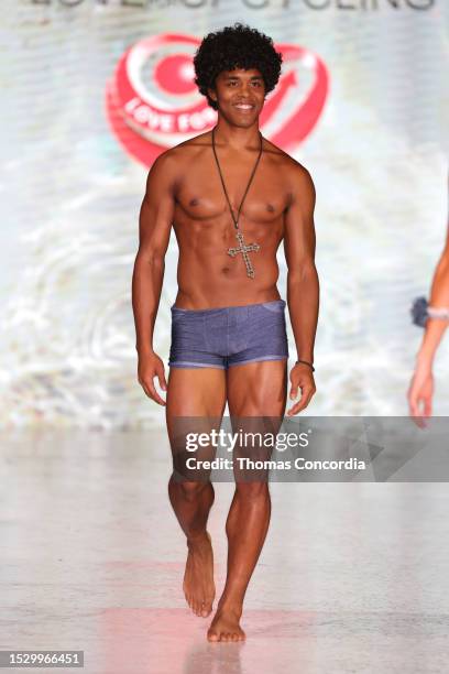 Model walks the runway for Love For Upcycling Show during Miami Swim Week The Shows at SLS South Beach on July 09, 2023 in Miami Beach, Florida.