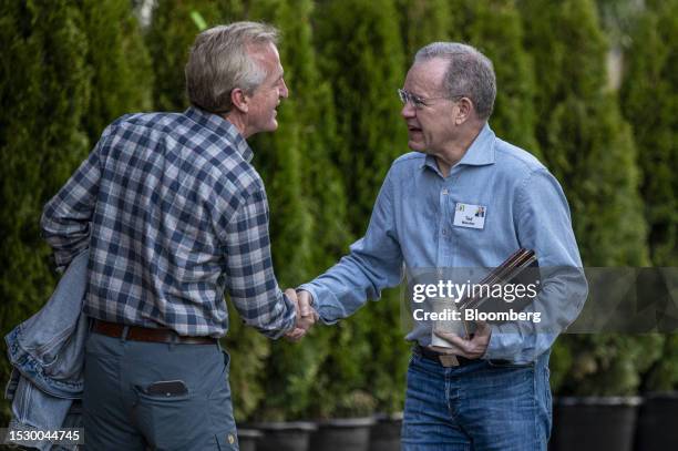 Chris Davis, chairman at Davis Selected Advisors LP, left, and Ted Weschler, portfolio manager at Berkshire Hathaway Inc., during the Allen & Co....