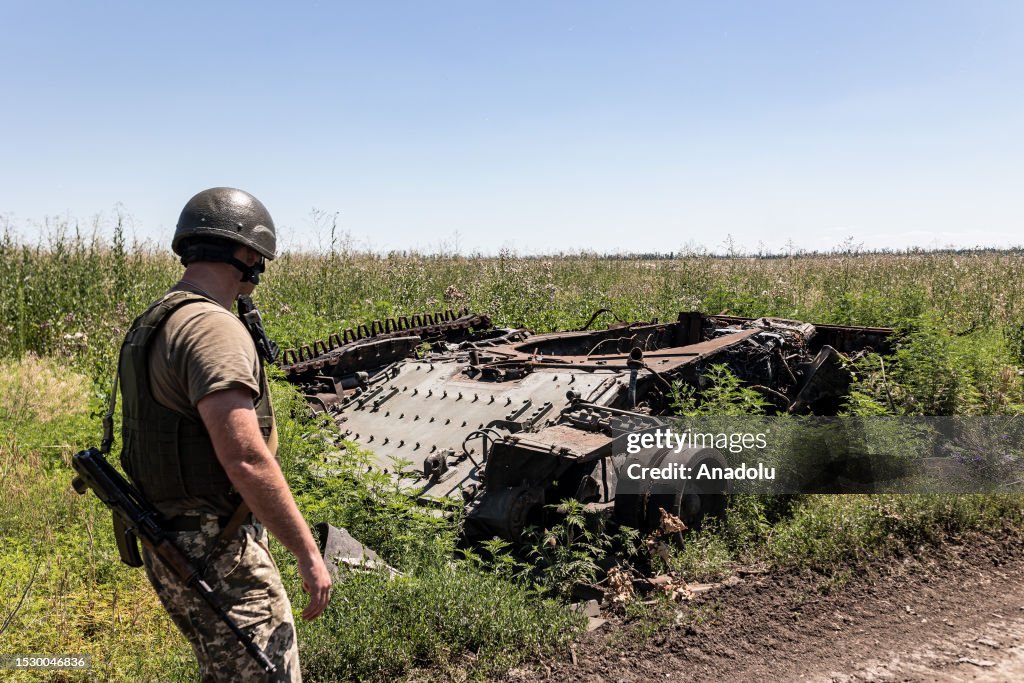 Ukraine 35 Ukrainian soldier of the 35th Brigade next to a destroyed Russian ...
