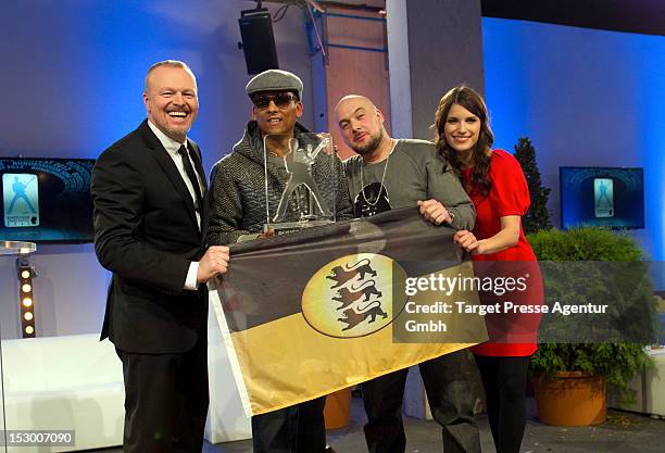 Stefan Raab, Xavier Naidoo, Kool Savas and Sandra Riess pose for the media after the 'Bundesvision Song Contest 2012' at the Max-Schmeling-Halle on...