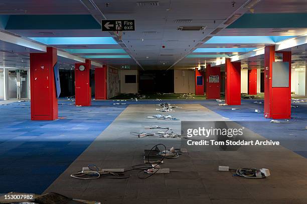 The deserted interior of the Sun newsroom inside the former News International base in Wapping, East London. Media mogul Rupert Murdoch moved his...