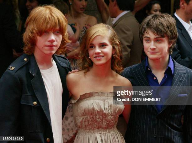 Daniel Radcliffe , who plays Harry Potter, Emma Watson , who plays Hermione Granger, and Rupert Grint, who plays Ron Weasley, smile before the...
