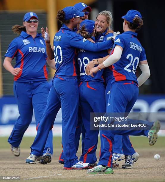 Katherine Brunt of England is congratulated after taking the wicket of Amita Sharma of India during the ICC Women's World Twenty20 2012 Group A match...