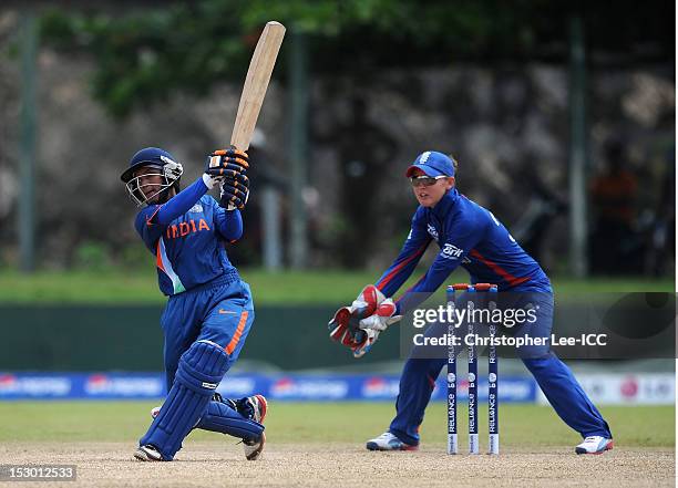 Poonam Raut of India in action as Sarah Taylor of England watches during the ICC Women's World Twenty20 2012 Group A match between England and India...