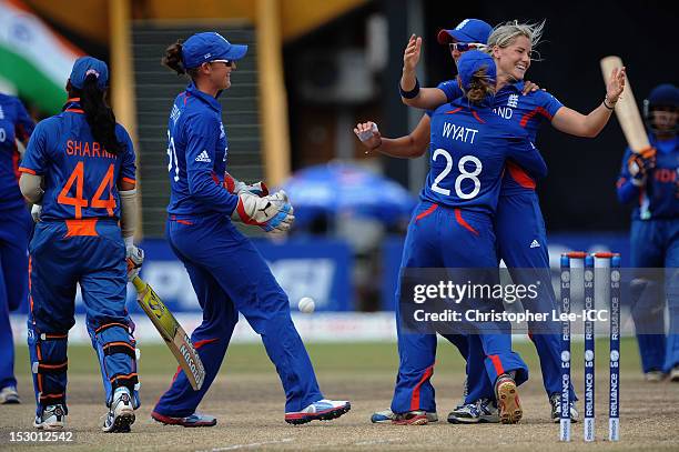 Katherine Brunt of England is congratulated after taking the wicket of Amita Sharma of India during the ICC Women's World Twenty20 2012 Group A match...
