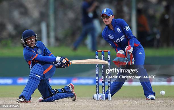 Poonam Raut of India in action as Sarah Taylor of England watches during the ICC Women's World Twenty20 2012 Group A match between England and India...