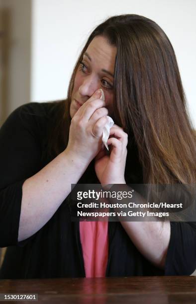 Brie Ana Williams wipes tears off her cheek during a press conference at the Pinkerton Law Firm about her lawsuit against the Los Vaqueros Trail Ride...