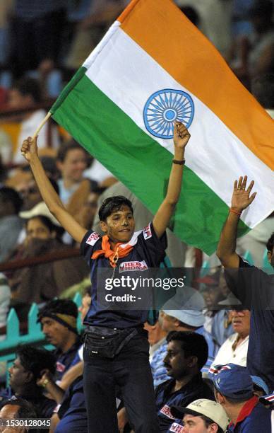 An Indian fan celebrates India's victory by 82 runs over England in the ICC Cricket World Cup 2003 game between England and India at Kingsmead...