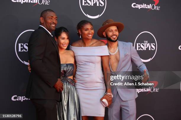 Hollywood, CA Metta Sandiford-Artest and wife Maya Sandiford-Artest, left, and basketball player Angel McCoughtry and guest arrive on the red carpet...