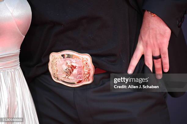 Hollywood, CA Pat McAfee displays his large belt buckle as he arrives on the red carpet at the 2023 ESPY Awards in Dolby Theatre in Hollywood...