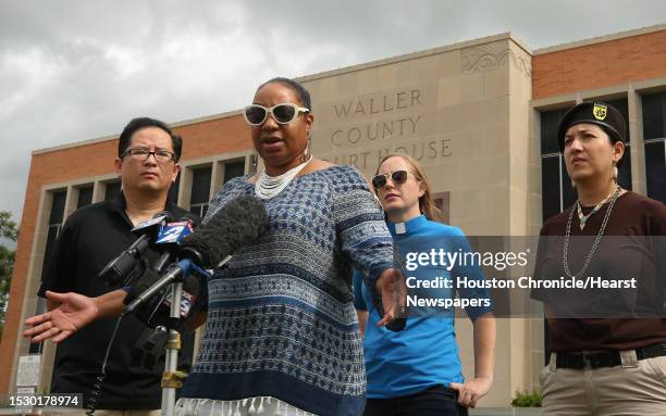 Cynthia Cole, center, board member at the Greater Houston Coalition for Justice, talks about the perjury charges against Brian Encinia being dropped...