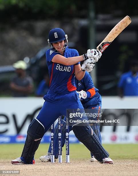 Charlotte Edwards of England in action as Sulakshana Naik of India stands by the stumps during the ICC Women's World Twenty20 2012 Group A match...