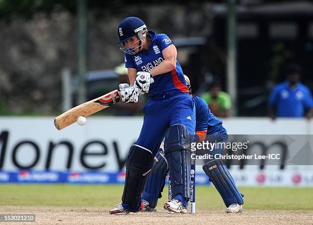 Charlotte Edwards of England in action as Sulakshana Naik of India stands by the stumps during the ICC Women's World Twenty20 2012 Group A match...